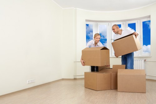 Moving team carrying household furniture during a Waddon relocation