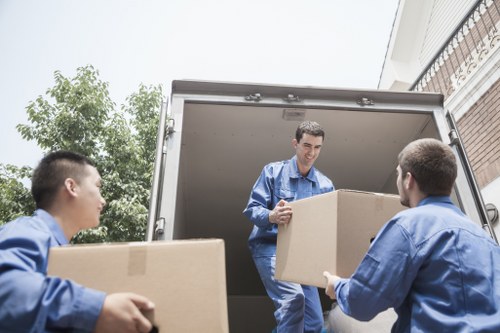 A driver helping with a small move and lifting items safely