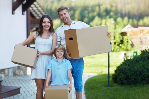 Packed boxes and furniture prepared for a local move in Waddon