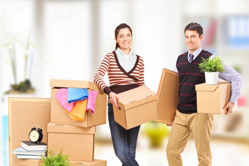 Packed moving boxes and furniture ready for a house move in Waddon
